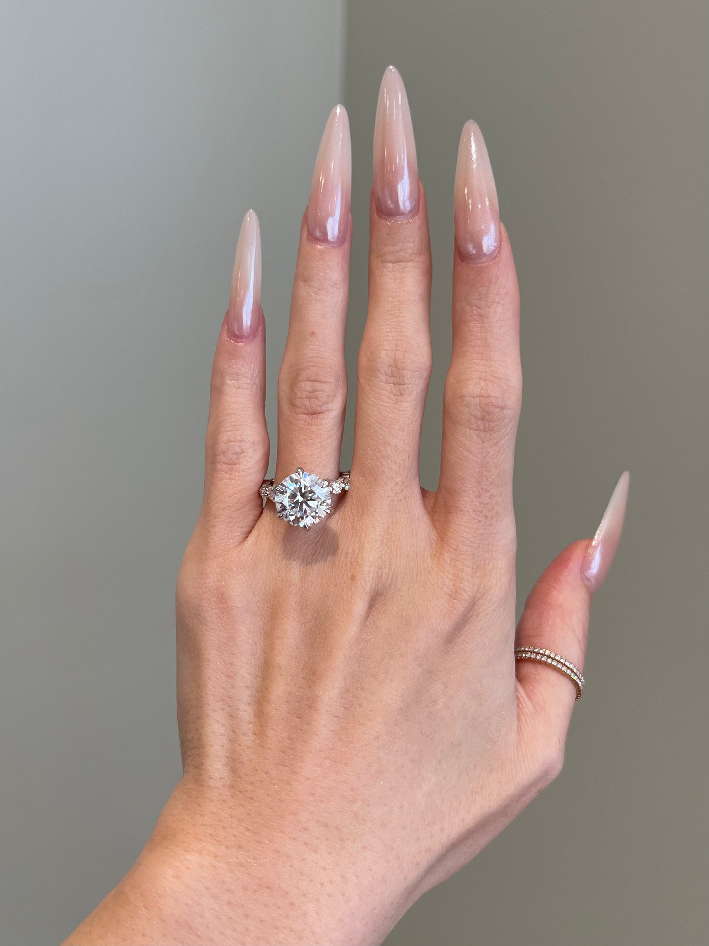 Brilliant Round Moissanite, 6-Prong Shared Prong Pavé