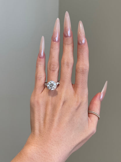 Brilliant Round Moissanite, 6-Prong Shared Prong Pavé