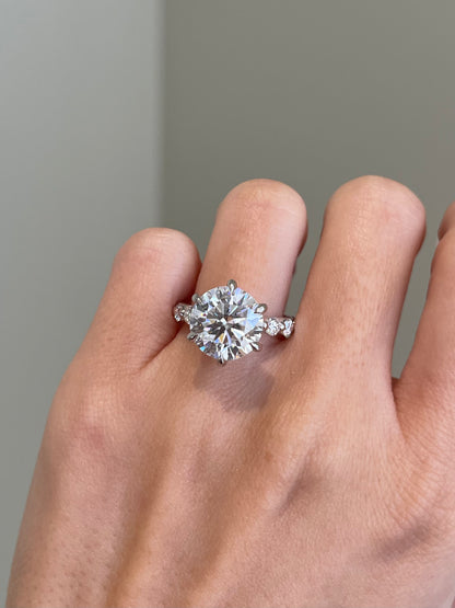 Brilliant Round Moissanite, 6-Prong Shared Prong Pavé