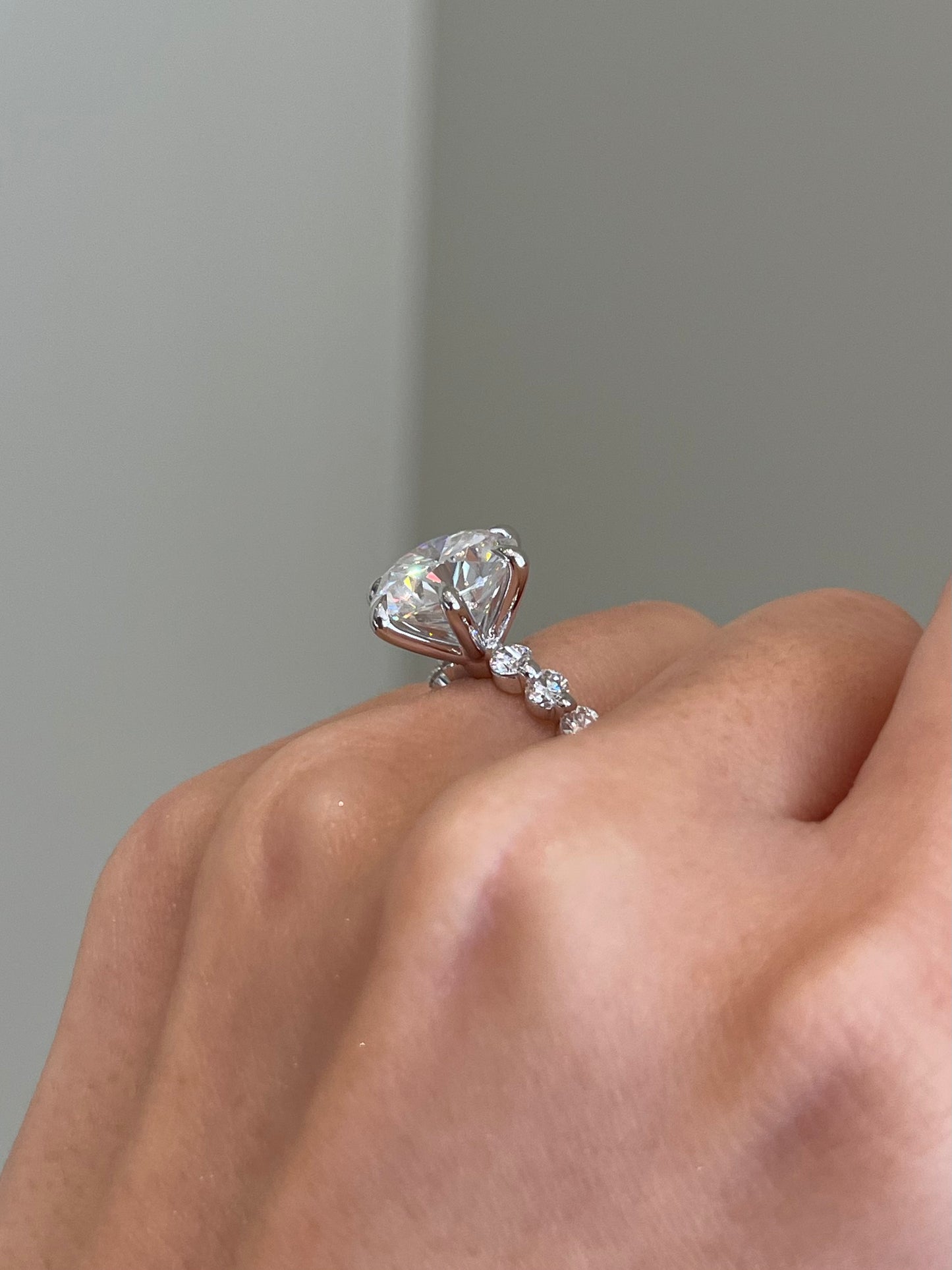 Brilliant Round Moissanite, 6-Prong Shared Prong Pavé