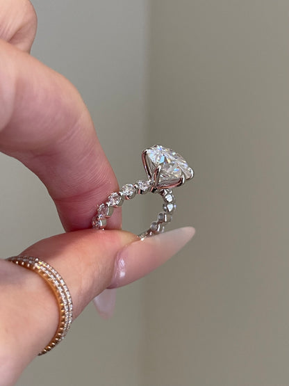 Brilliant Round Moissanite, 6-Prong Shared Prong Pavé